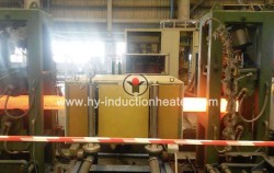 Continuous cast billet induction reheating furnace